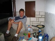 The old lady wouldn't let us use her kitchen so we had to cook outside in her yard and it damn well rained