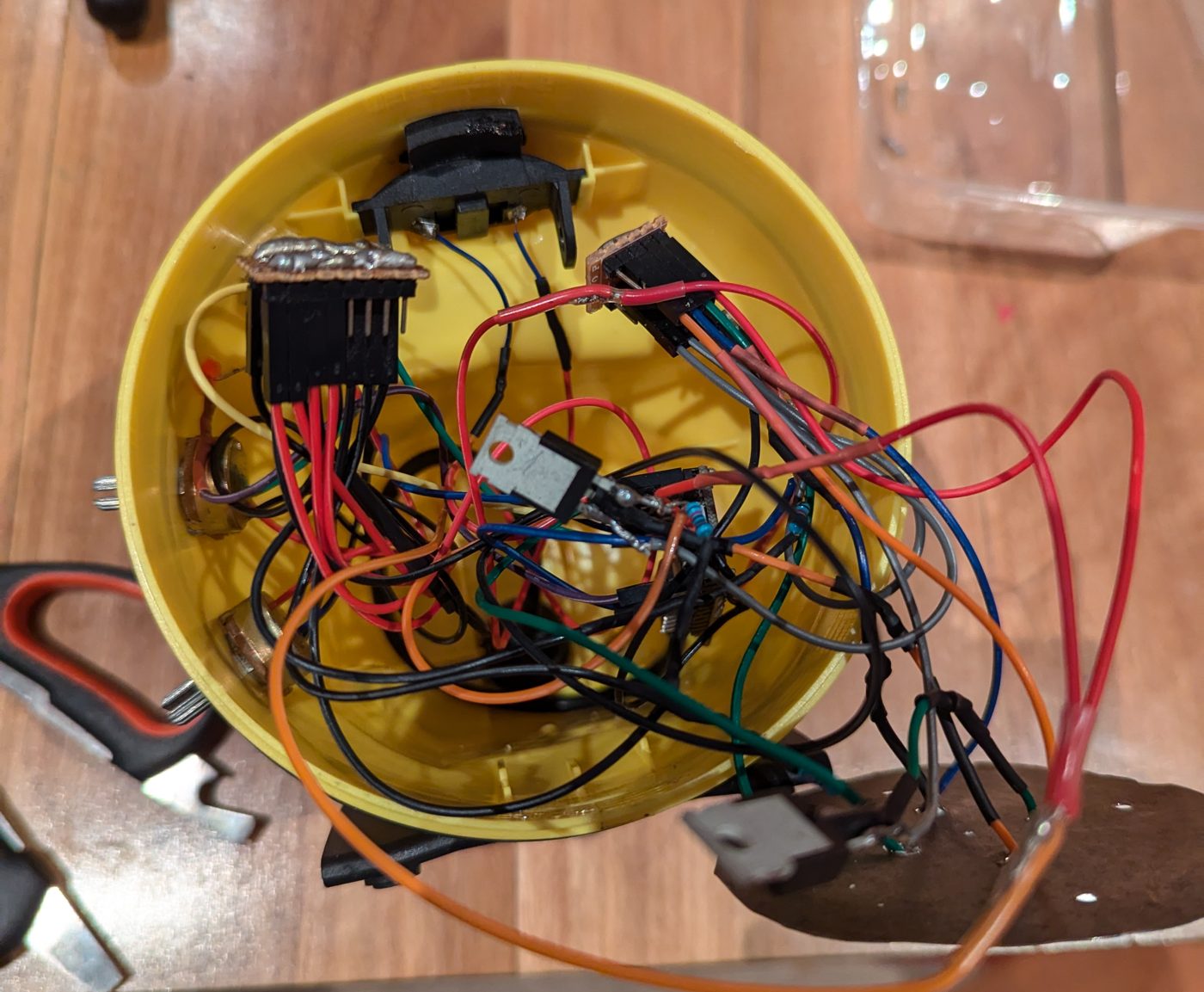Inside the yellow torch body packed with coloured wires, MOSFETs and the Qduino